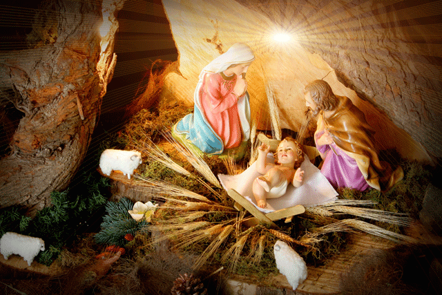 Grote animatie van een kerststal - Jozef en Maria bij het kindeke Jezus in de kribbe met erboven de schijnende ster van Bethlehem