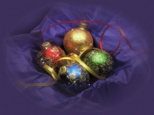 Grote kerstanimatie van een kerstbal - Vier kerstballen met witte sterretjes